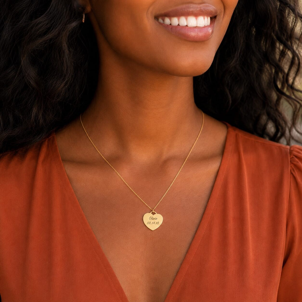 woman wearing a personalized heart pendant necklace