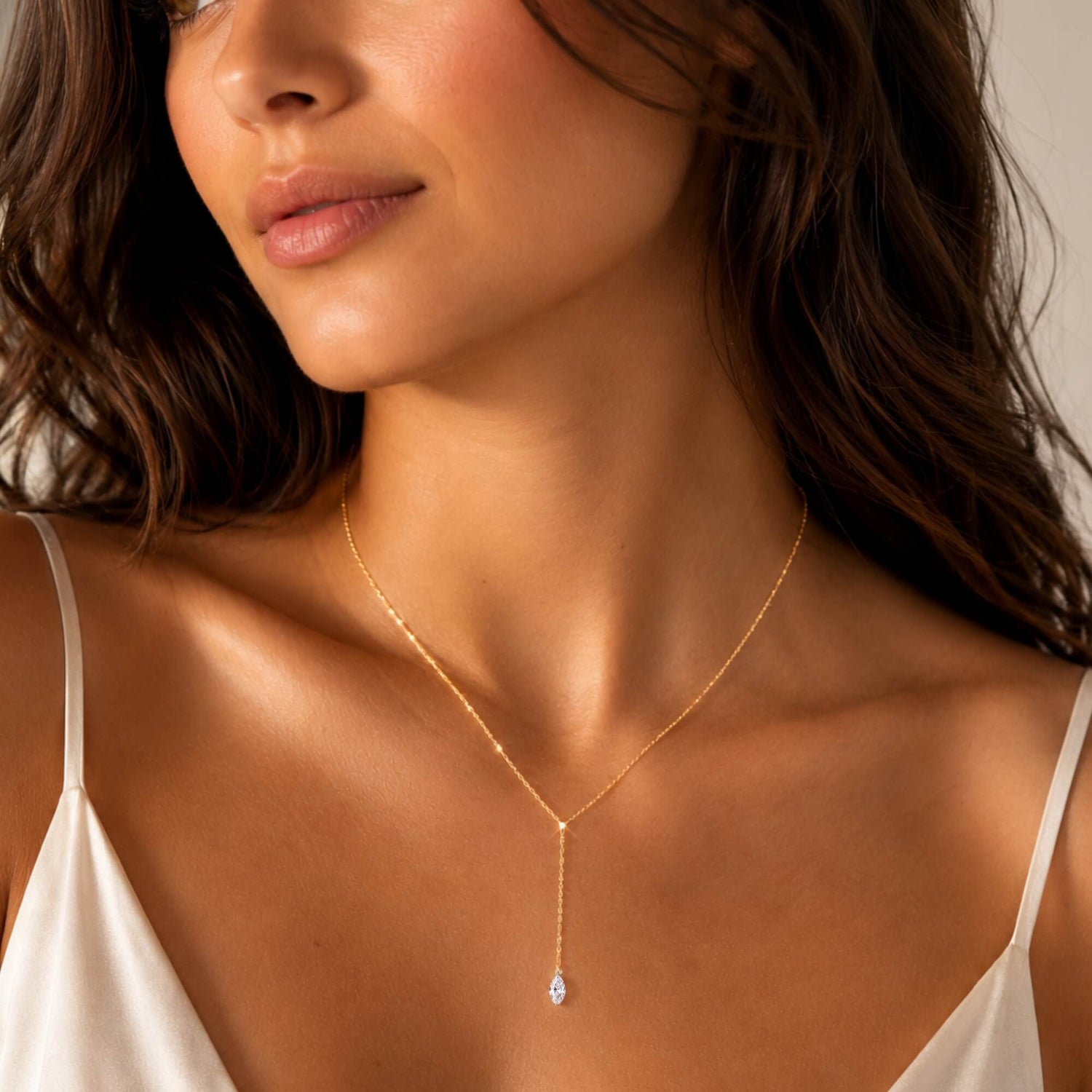 woman wearing a marquise diamond lariat necklace