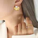 woman wearing diamond stud earrings