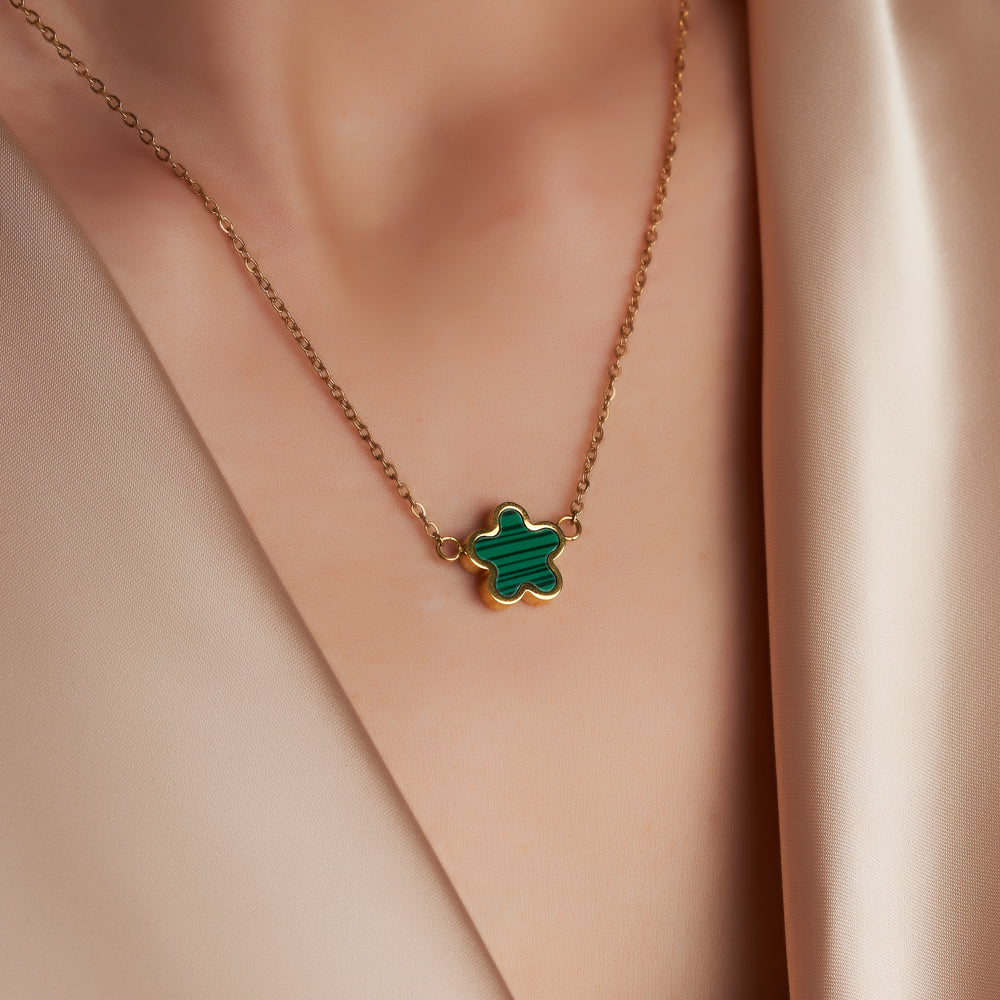 woman wearing clover leaf necklace