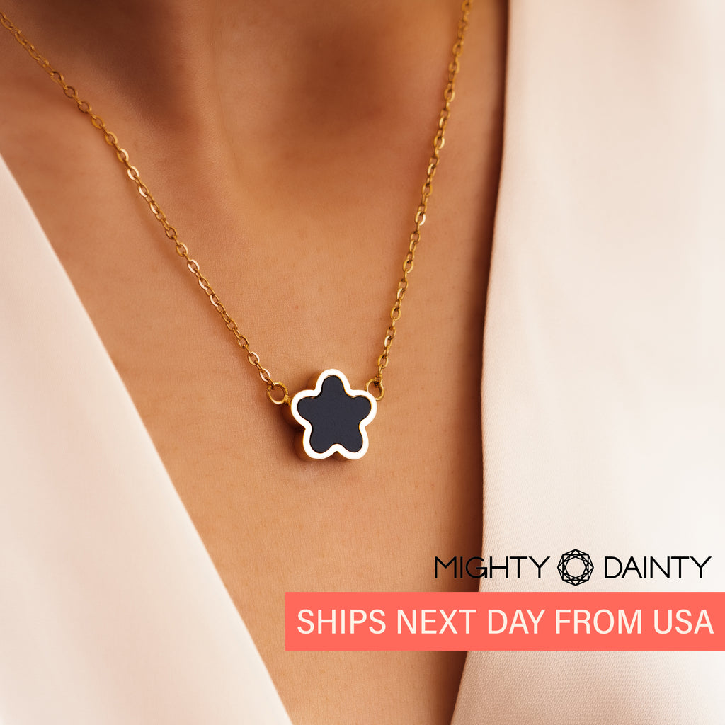 Black flower shaped gold plated necklace