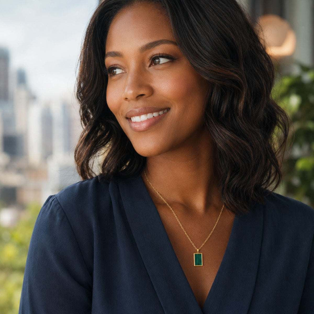 woman wearing a green malachite necklace