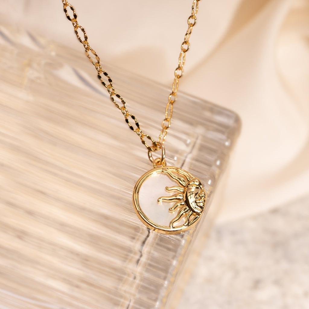 Gold sun and pearl round pendant necklace