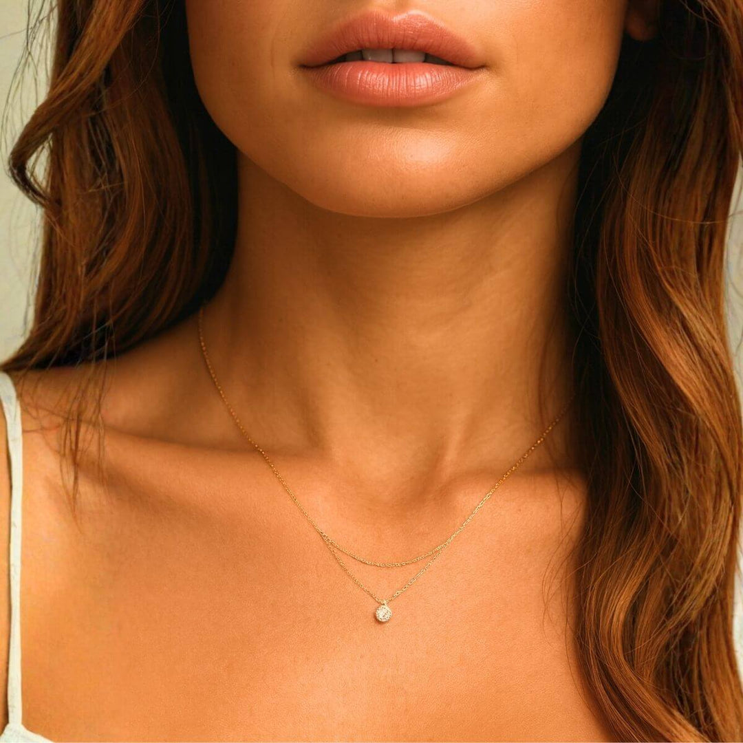 woman wearing a diamond layered necklace
