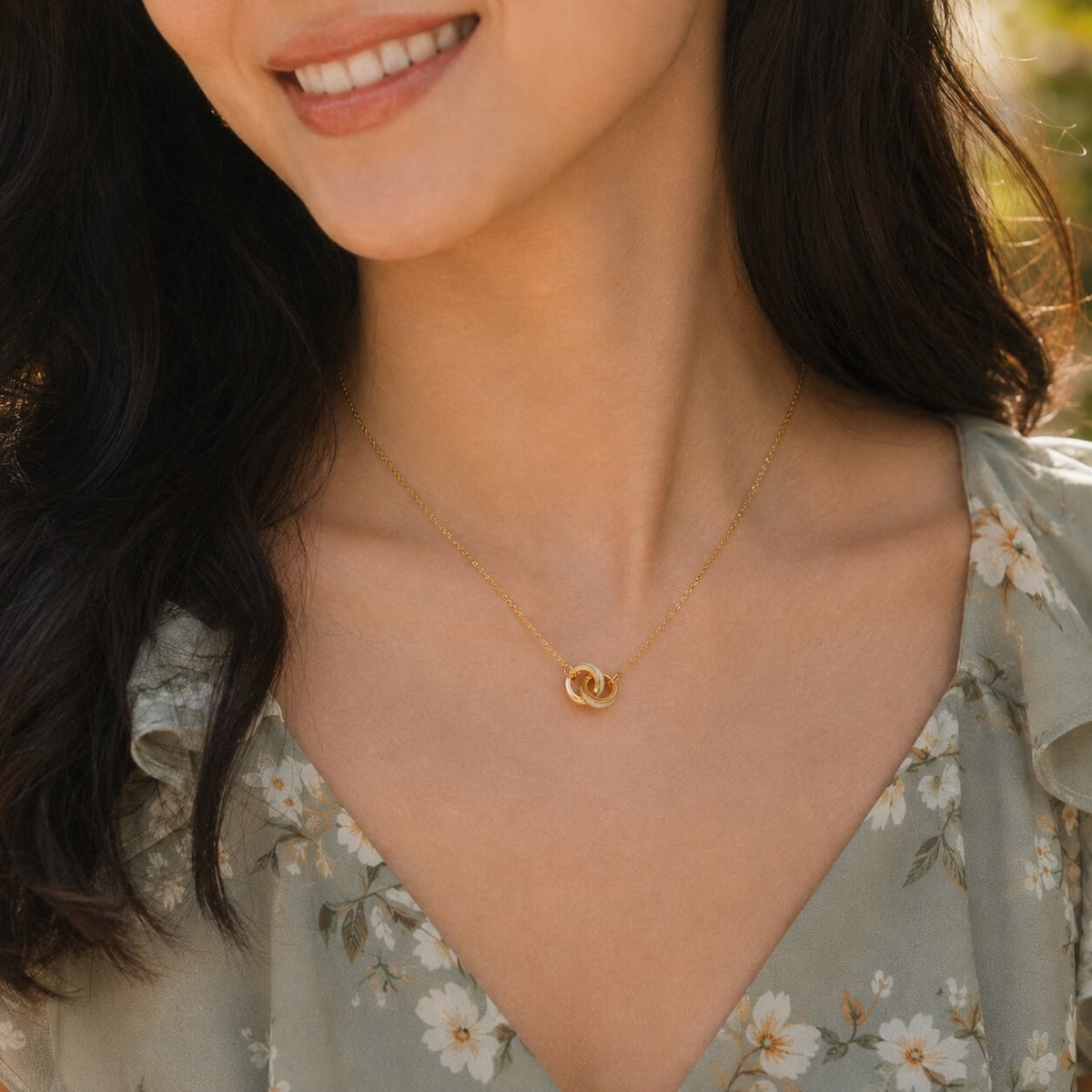 woman wearing an interlocking circle necklace