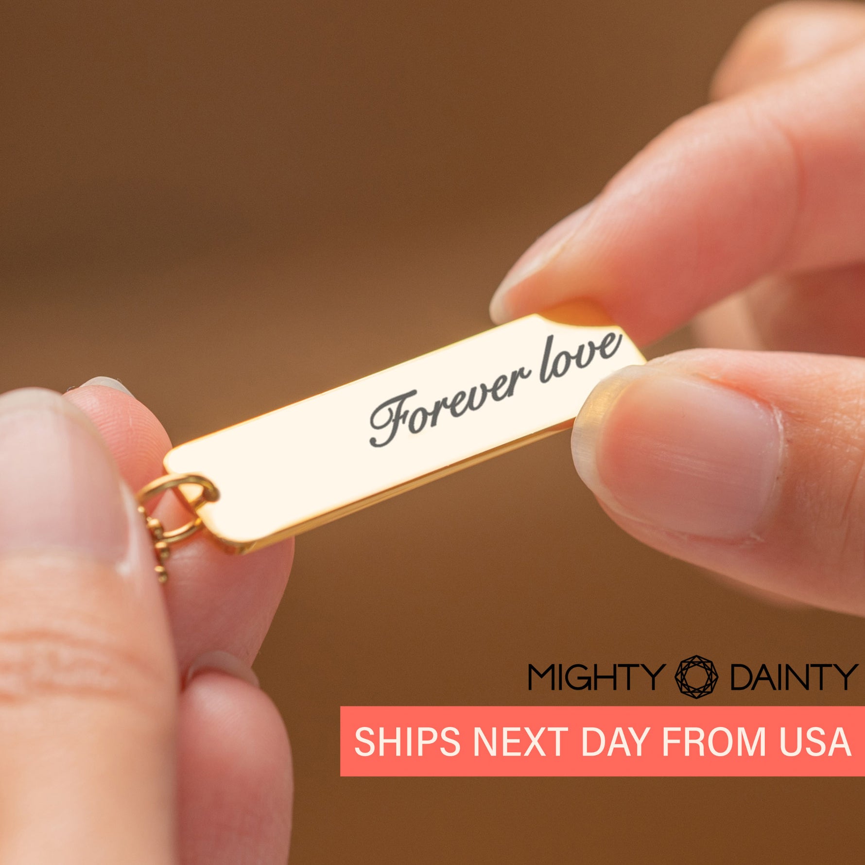 woman holding personalized name necklace